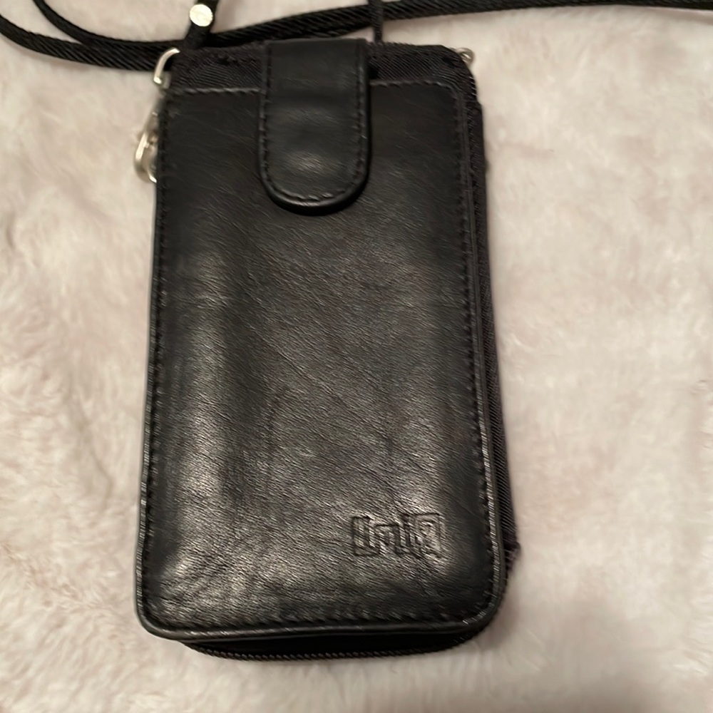 Vegan leather and fabric black crossbody bag.